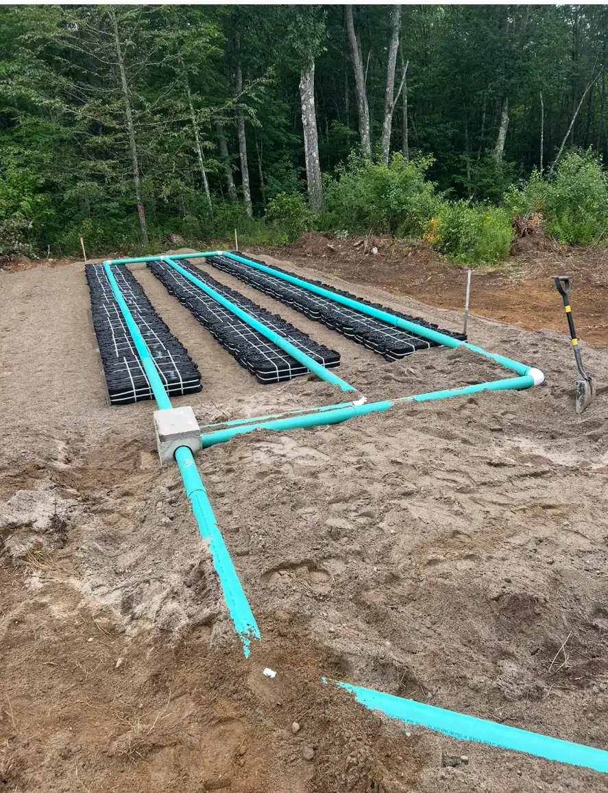 New septic leach field with chamber rows and distribution piping installed in Gardiner, Maine